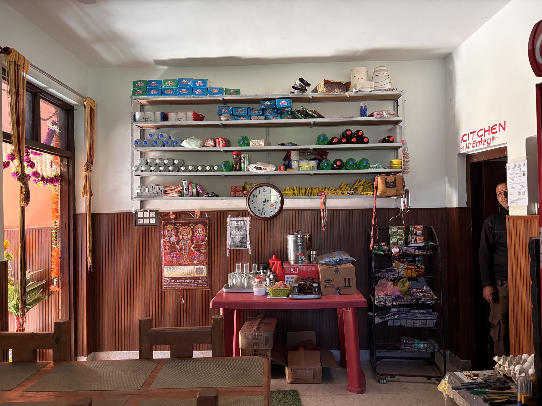Shop shelves stocked with everyday goods