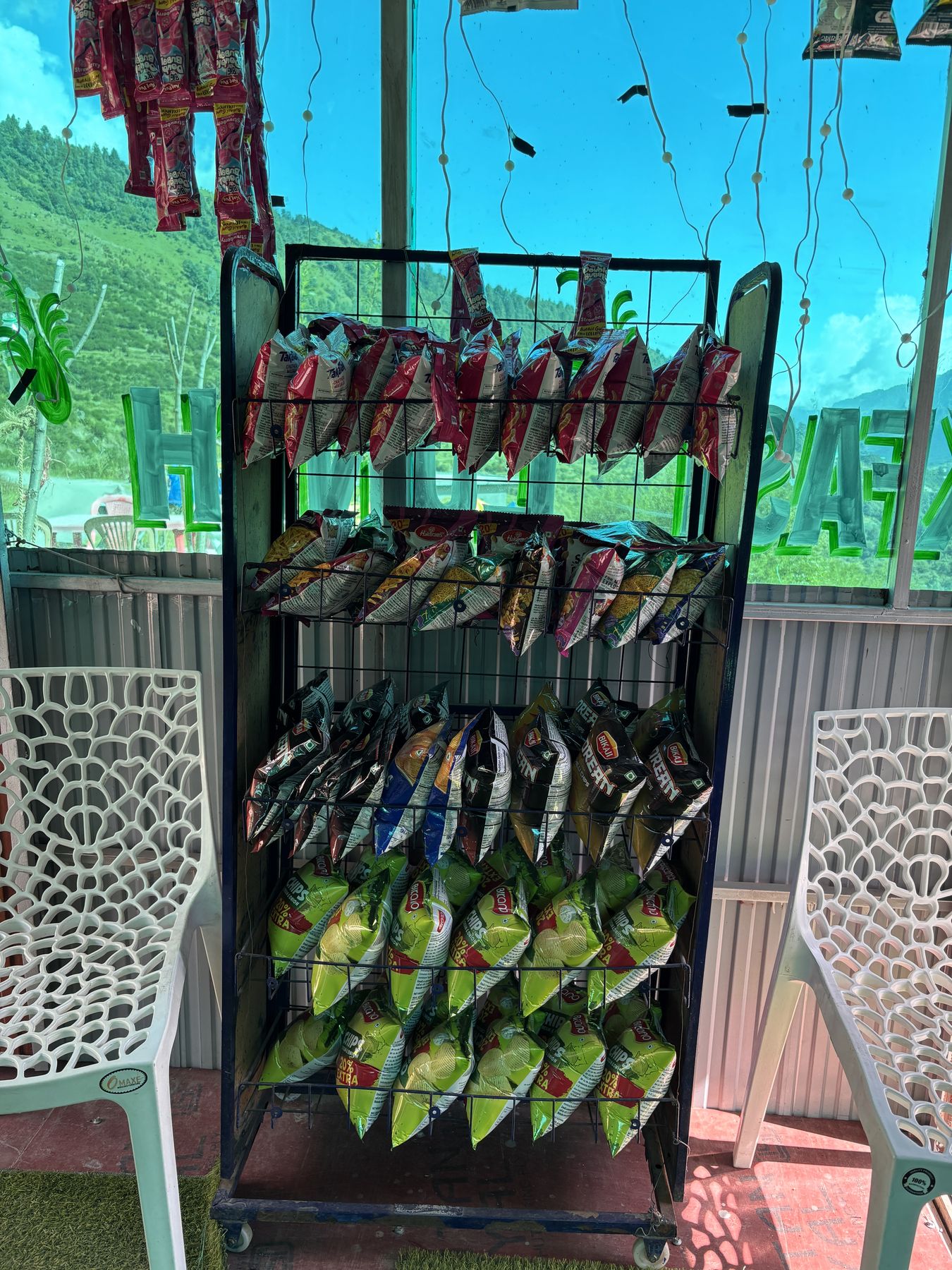 A rack of packets by the shop window